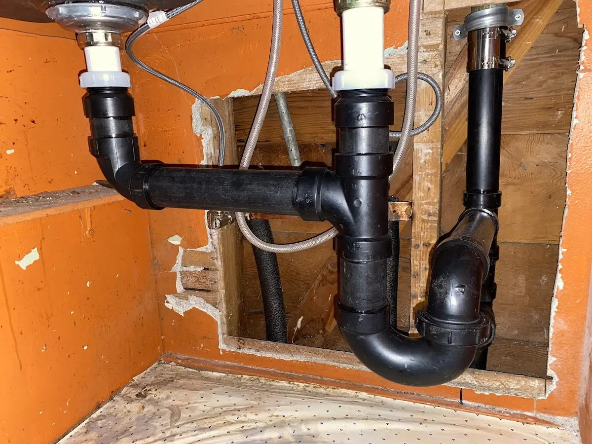Professional Garbage Disposal Repair equipment and tools on the job in Addison